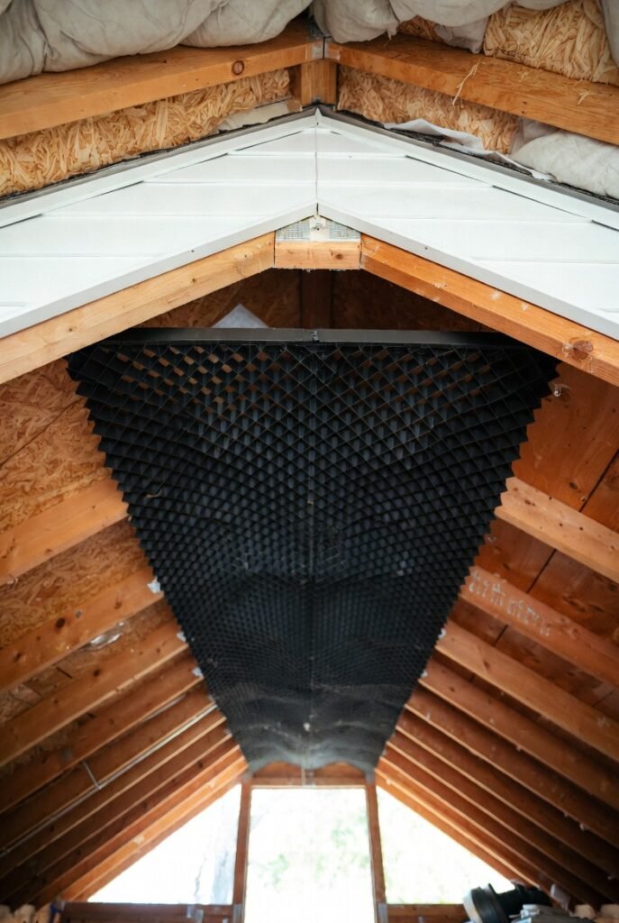Baffles installed at attic eaves to keep soffit ventilation airflow open.